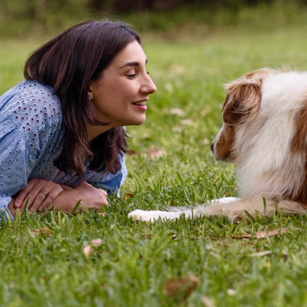 Tamika Bentley face to face with a dog on the grass 2x